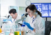 Transplanted Organ Takes on Age of New Body! Scientist using a microscope in a modern laboratory