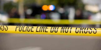 Police tape cordons off a street