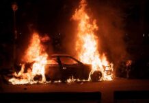 Ghost Flames Engulf McLaren Wreck Burning car engulfed in flames at night