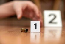 Father And Twins Found Dead In Orlando Bullet casing beside evidence marker 1 on floor
