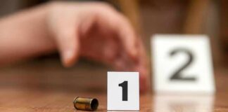 Father And Twins Found Dead In Orlando Bullet casing beside evidence marker 1 on floor