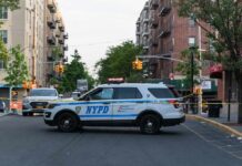 Domestic Violence Horror In The Sky NYPD police SUV blocking a city street at a taped-off scene