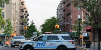 Domestic Violence Horror In The Sky NYPD police SUV blocking a city street at a taped-off scene