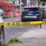 Police tape cordons off a city street