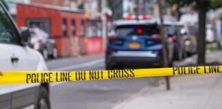 Police tape cordons off a city street