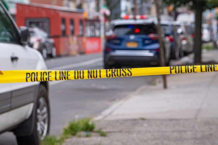 shutterstock_2018131463 Police tape cordons off a city street