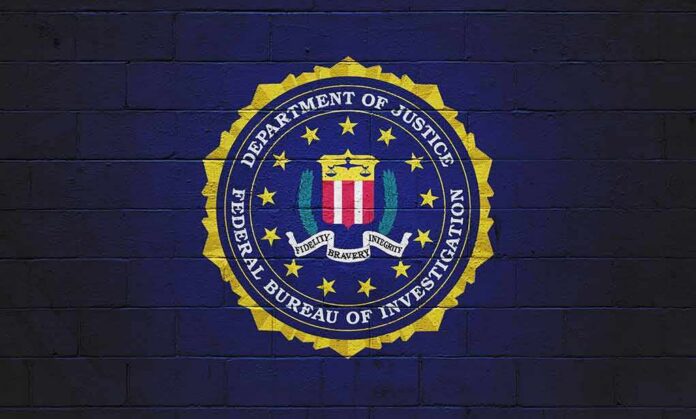 shutterstock_2073117407 FBI seal painted on a dark brick wall