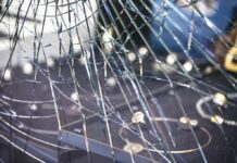 Shattered glass window with jewelry display behind