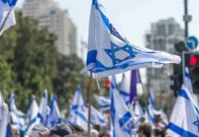 Netanyahu’s Majority Nightmare Begins Israeli flags waved at a street demonstration