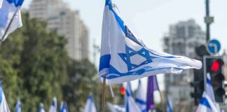Netanyahu’s Majority Nightmare Begins Israeli flags waved at a street demonstration