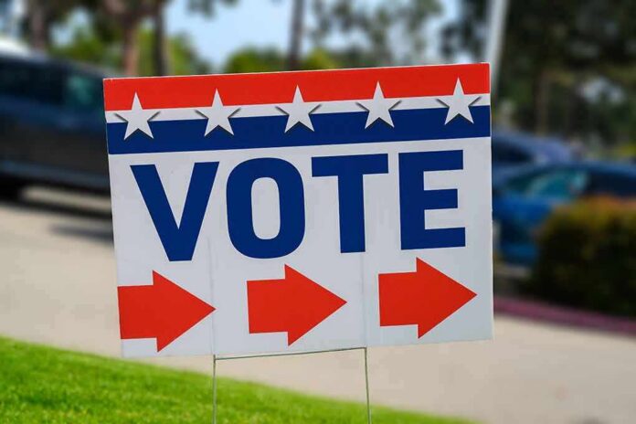 shutterstock_2304975231 Election sign with the word VOTE and red arrows