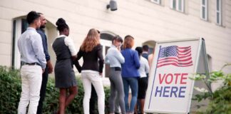voters standing in line outside a polling place
