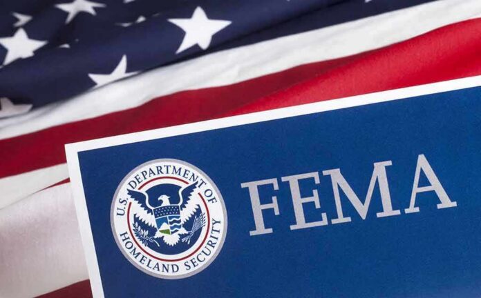 FEMA sign with U.S. flag background
