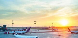 Delta Passenger Steals Airport Tug Airplanes on airport tarmac at sunset