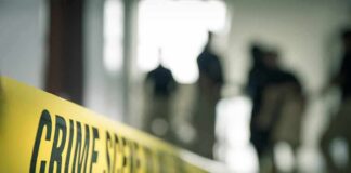 Vacation Turned Nightmare at Great Wolf Crime scene tape with investigators in the background