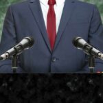 speaker at podium with microphones